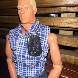 Hasbro Barbie Blue Checkered top Google says 1st gay male dollThis says 1996